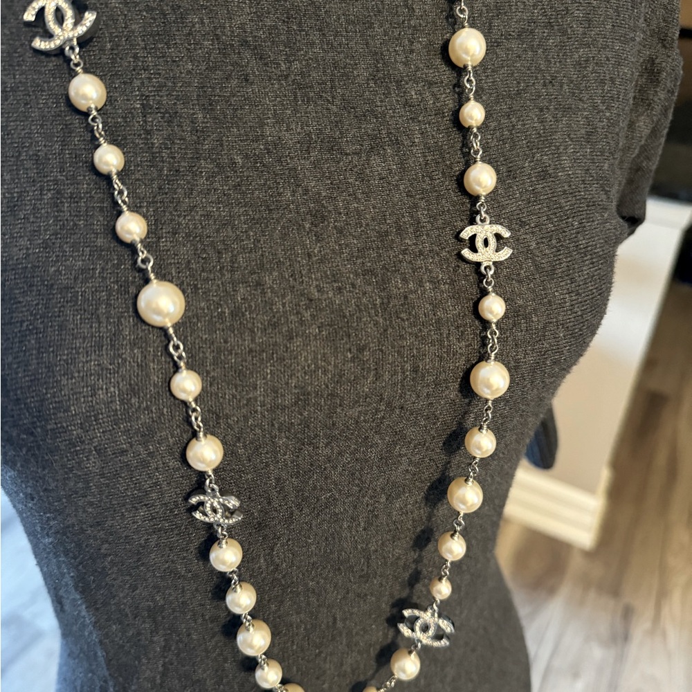 CHANEL white pearl with silver chain, & rhinestone CHANEL embellishments